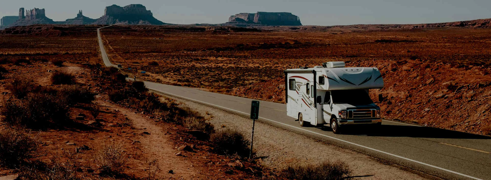RV driving at sunset — shop RV parts, hitches, solar, and generators