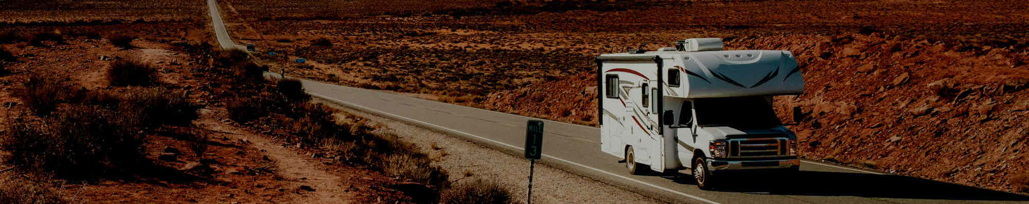 RV driving at sunset — shop RV parts, hitches, solar, and generators