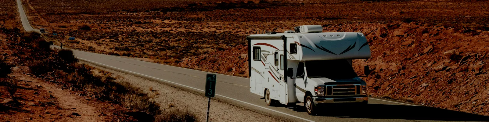 RV driving at sunset — shop RV parts, hitches, solar, and generators