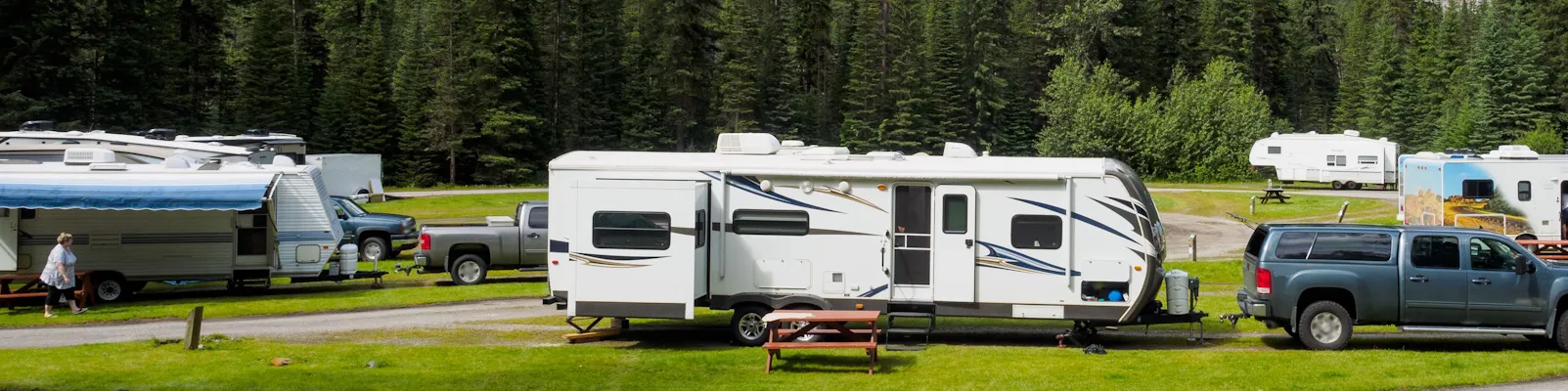 RV driving at sunset — shop RV parts, hitches, solar, and generators