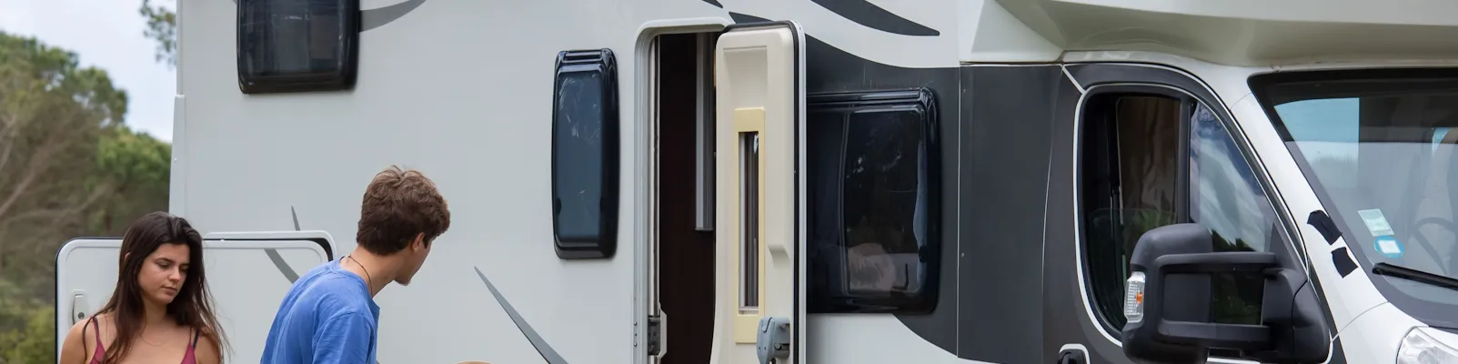 RV driving at sunset — shop RV parts, hitches, solar, and generators
