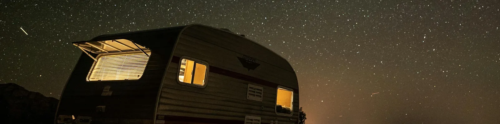 RV driving at sunset — shop RV parts, hitches, solar, and generators