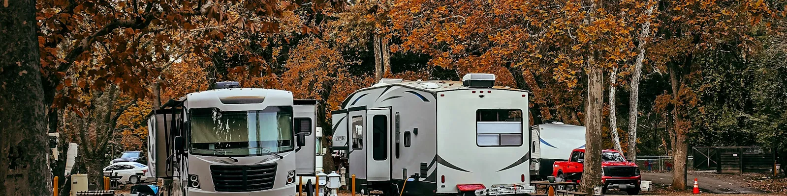 RV driving at sunset — shop RV parts, hitches, solar, and generators